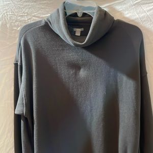 A gray extra small turtleneck sweatshirt with pockets in front